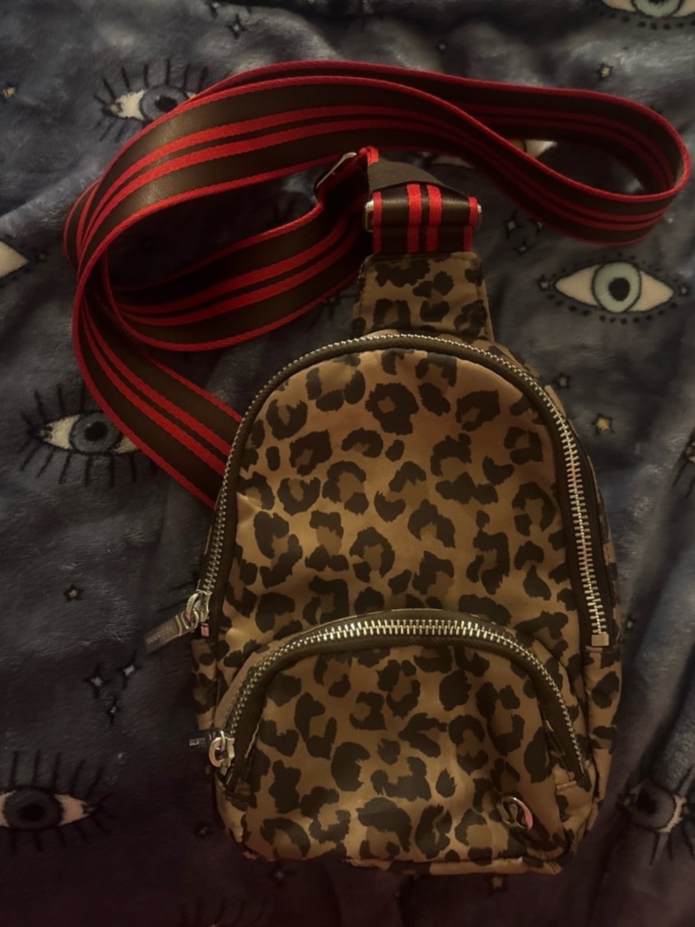 lululemon athletica Leopard Mini Sling Bag with Red-Striped Strap